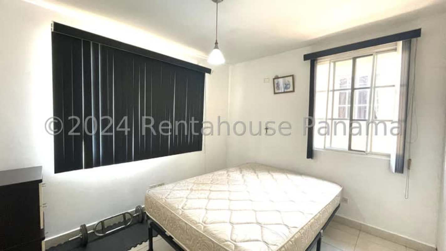 Home gym space with split AC, blue walls, ceiling fan in Dorado Lakes Panama City