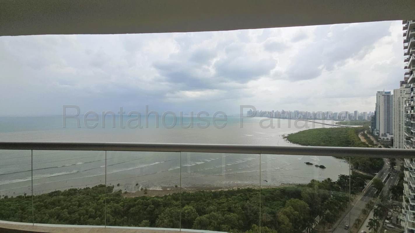 Infinity swimming pool overlooking ocean and city skyline at PH Lumiere Costa del Este Panama City