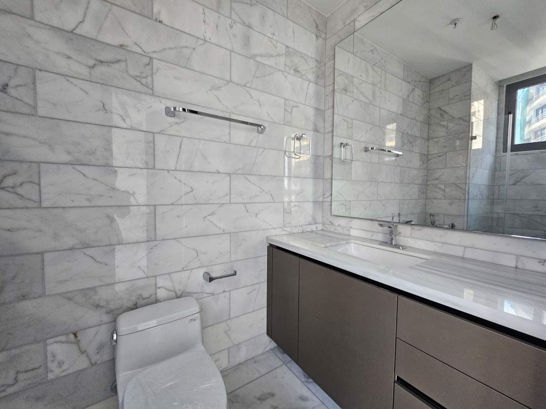 Spacious kitchen with modern cabinetry and island in Seapoint Punta Paitilla condo Panama City