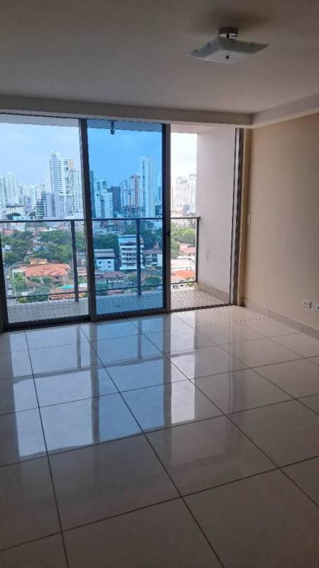 Modern living area with floor-to-ceiling sliding doors to balcony in Torres de Castilla Panama City