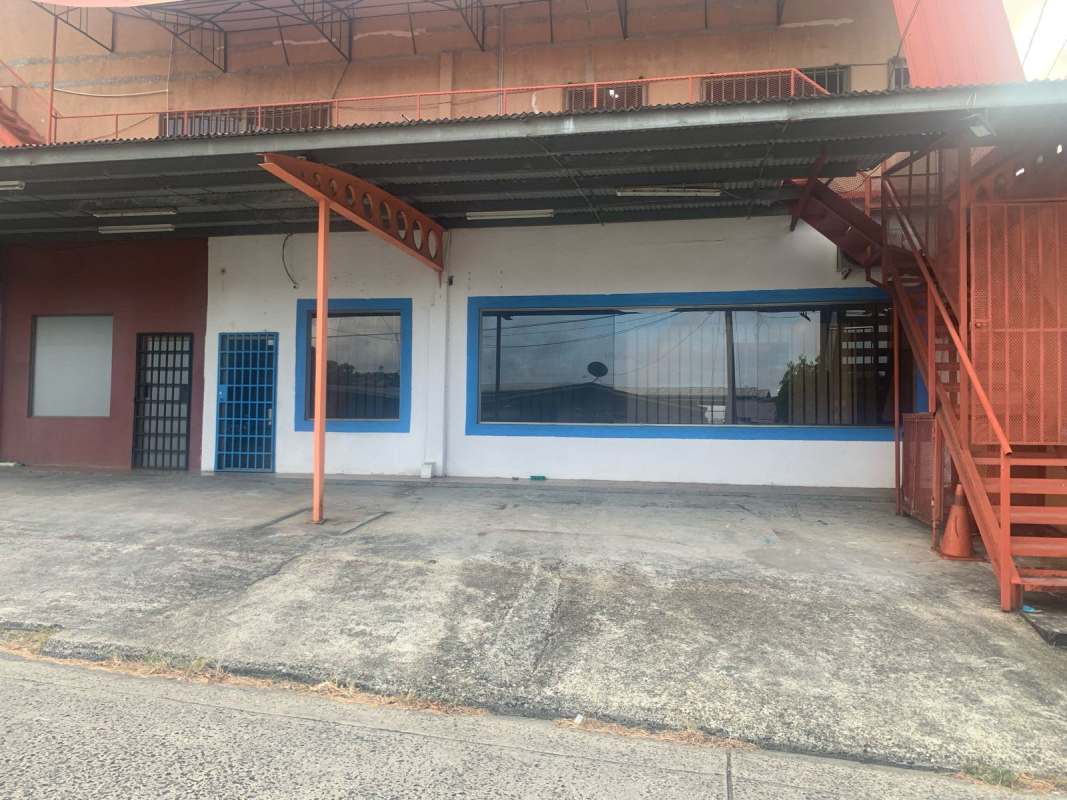 Vacant office or retail unit with tiled floor and large interior window at Villa de las Fuentes Panama