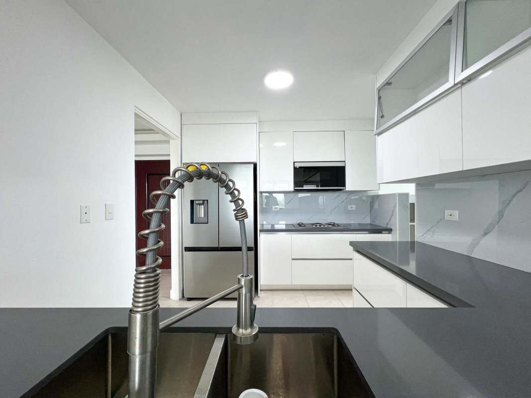 Bright living room with dining space, large windows, balcony in Clayton Park apartment