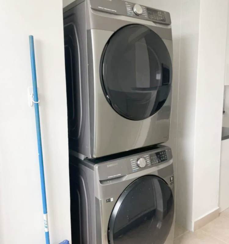 Laundry room with stacked appliances modern urban apartment Clayton Park Panama