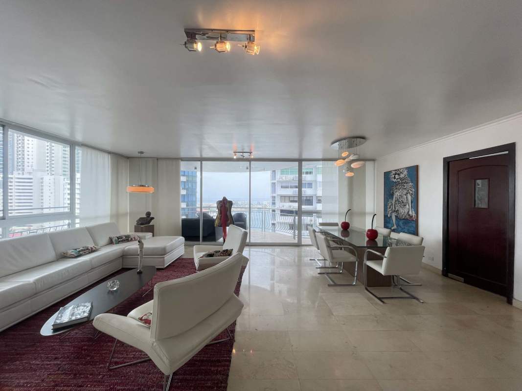 Kitchen with granite countertops, gas stove and wooden cabinetry at Punta Paitilla PH Vista del Sol