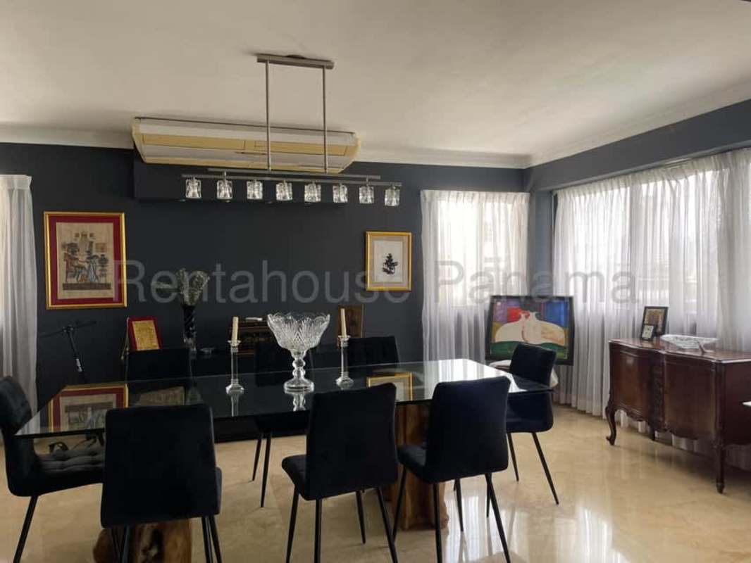 Balcony view of lush greenery and cityscape from Edificio Troy El Cangrejo Panama