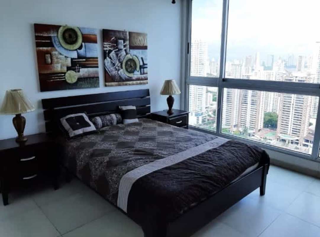 Bedroom with queen bed, modern furniture, large window, skyline view PH Park View Panama