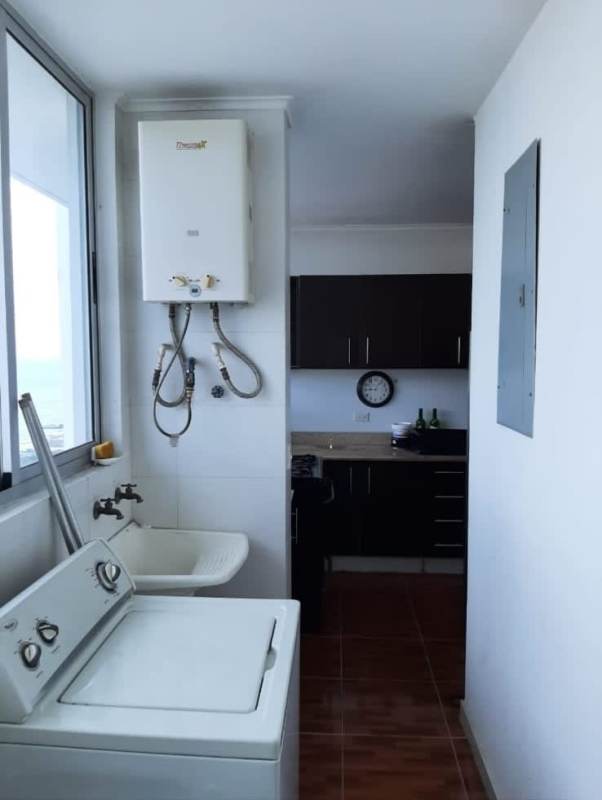 Second bedroom with modern furnishings, large windows, city skyline view PH Park View San Francisco Panama