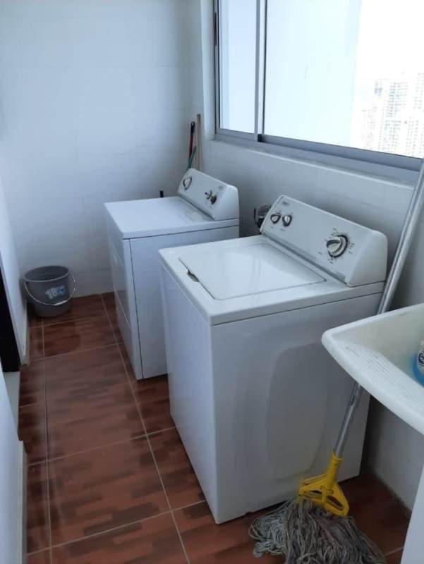 Master bedroom with large window, queen bed, modern decor, panoramic city view PH Park View Panama City