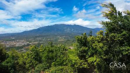 Aerial of large mountain lot with trees open land and shed in Jaramillo Boquete Panama