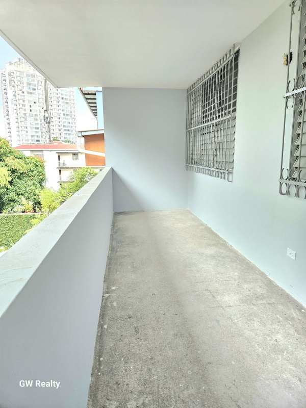 Spacious upstairs bedroom with large window in Betania Club X duplex