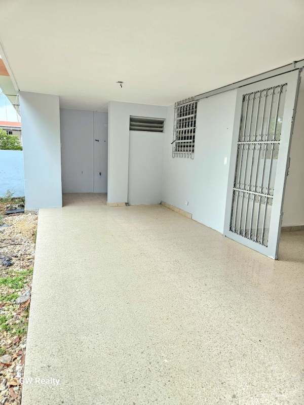 Covered carport with secured driveway at El Ingenio Club X Betania house for sale