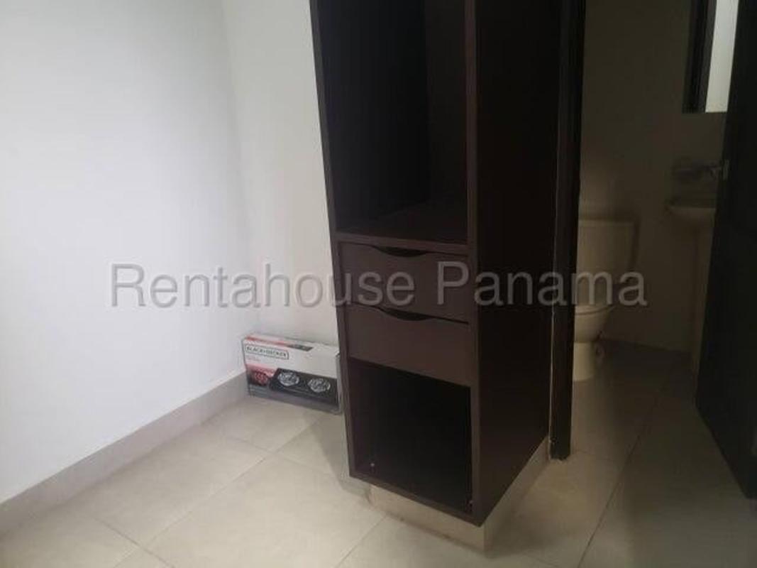 Covered balcony overlooking green gardens Embassy Club Clayton apartment Panama City