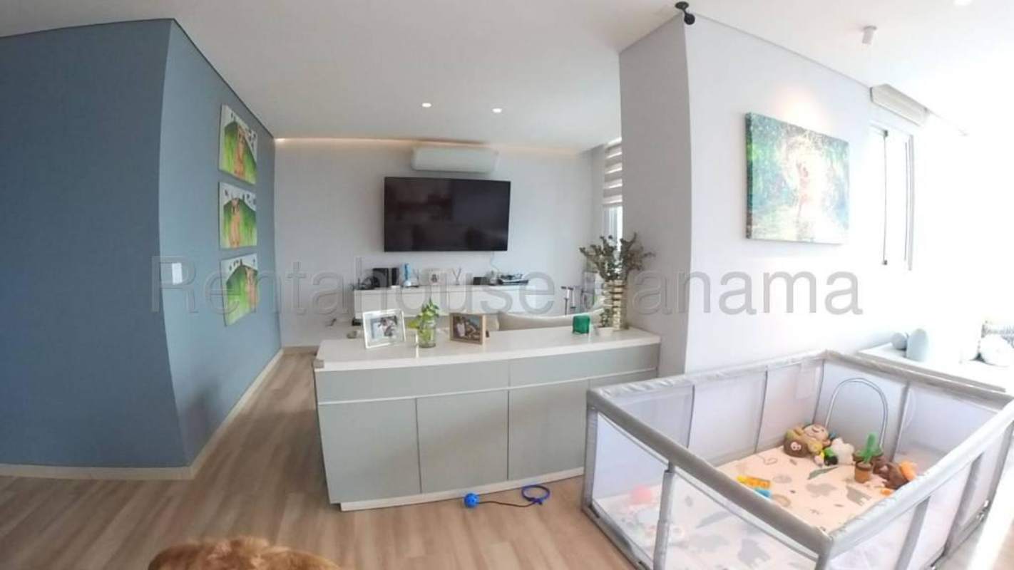 Elegant master bedroom with built-in closets and large windows in Panama City