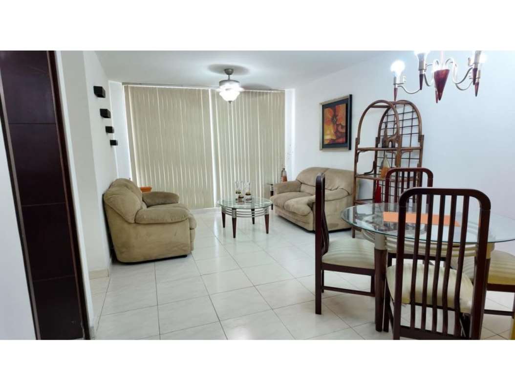Living dining space with beige sofas, blinds, ceiling fan at PH McGregor Heights Panama