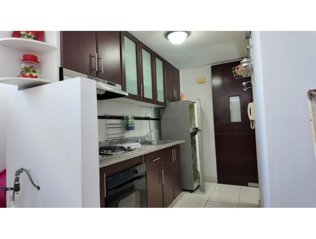 Kitchen with granite countertops, dark cabinets, appliances at PH McGregor Heights Panama