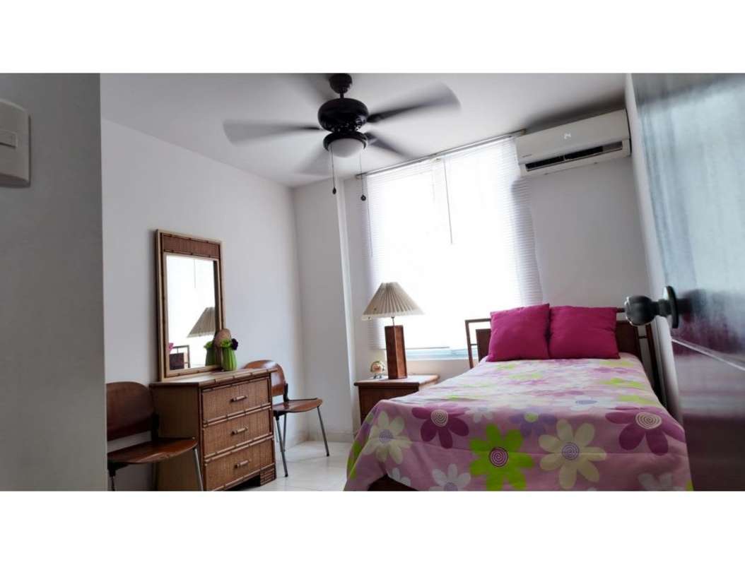 Bedroom featuring AC, ceiling fan, bed, dresser at PH McGregor Heights Panama City