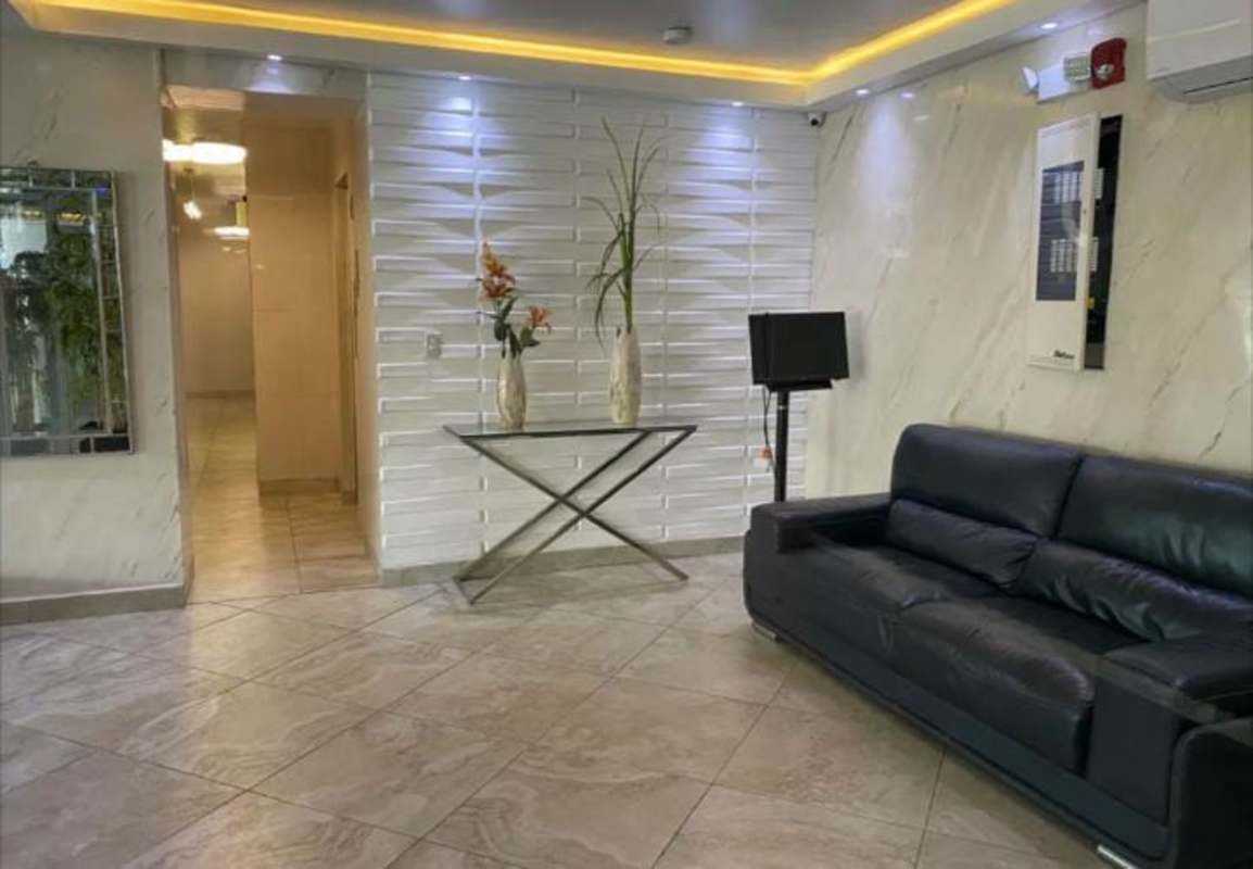 Modern lobby with sofa and reception at PH Central Park Panama City