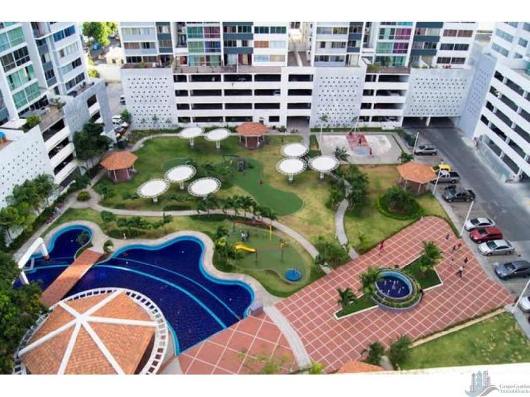 Aerial of condo complex with pool, gardens, playground in PH Central Park Panama