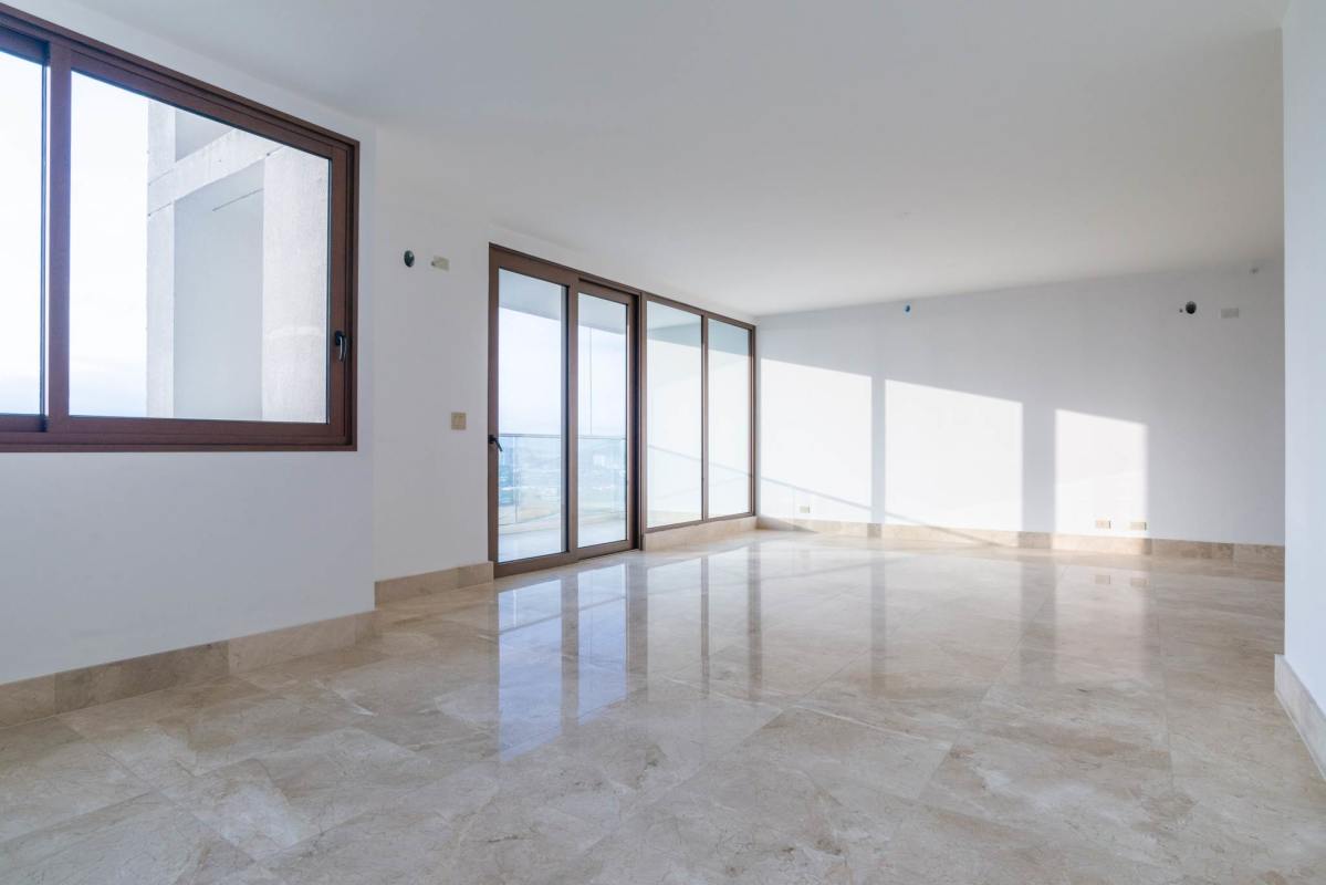 Bright living dining area with marble floors, panoramic windows, ocean views at PH Ocean House Panama