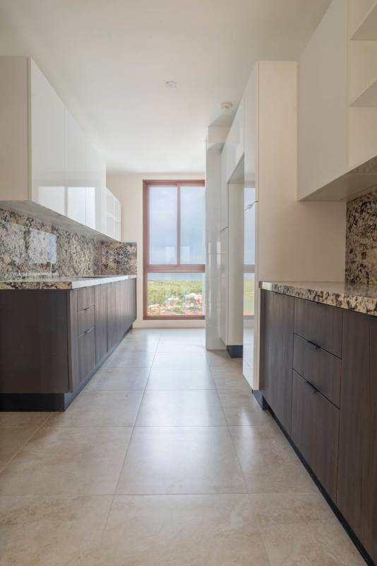 Designer modern kitchen with granite countertops and marble accents in PH Ocean House Santa Maria Panama