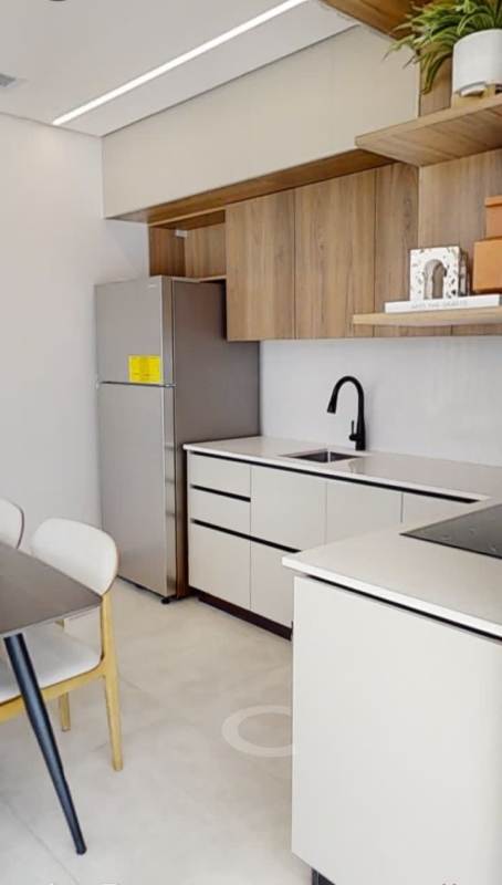 Wood cabinets integrated appliances modern open kitchen in Panama Generation Tower