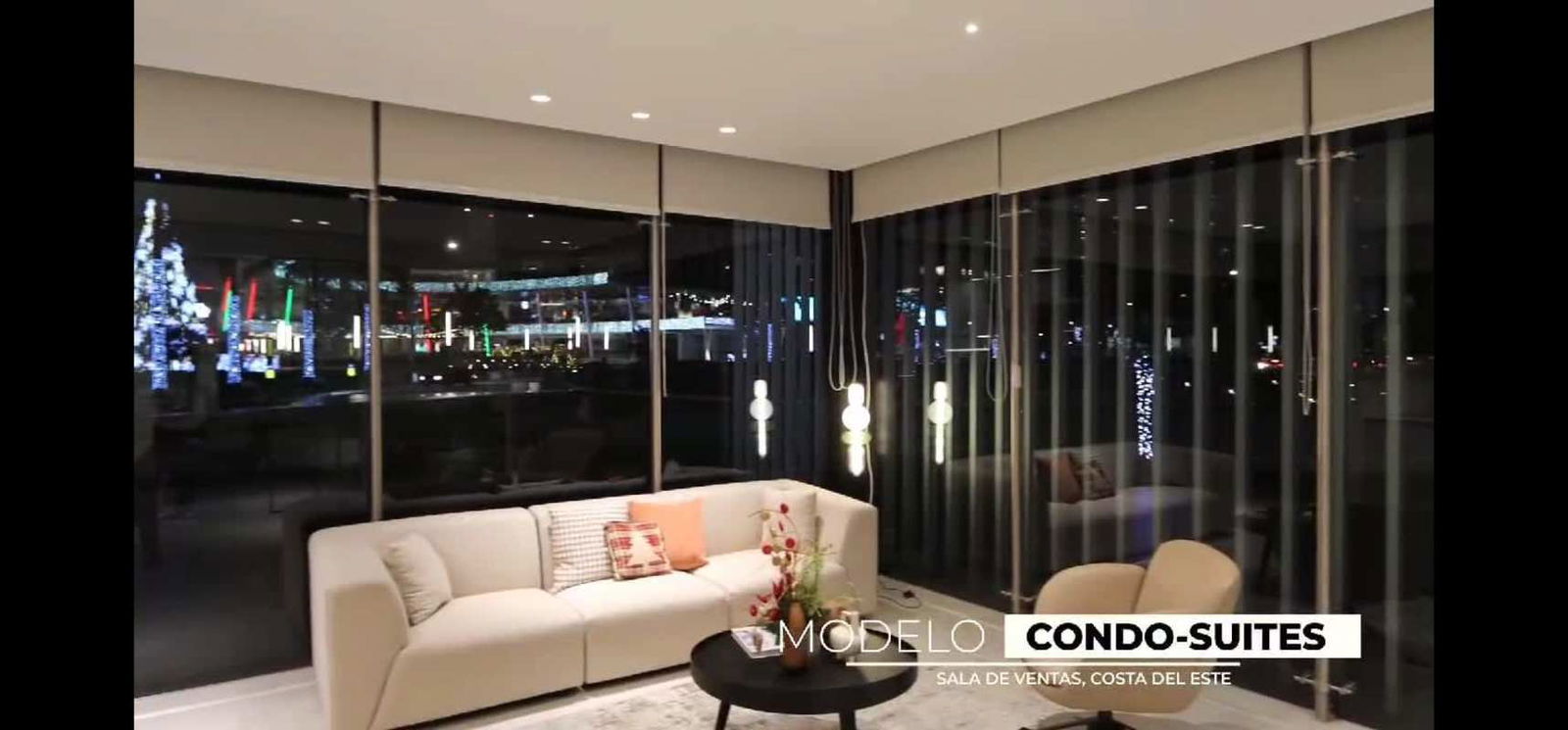 Furnished living room with city skyline views at night in Generation Tower Panama