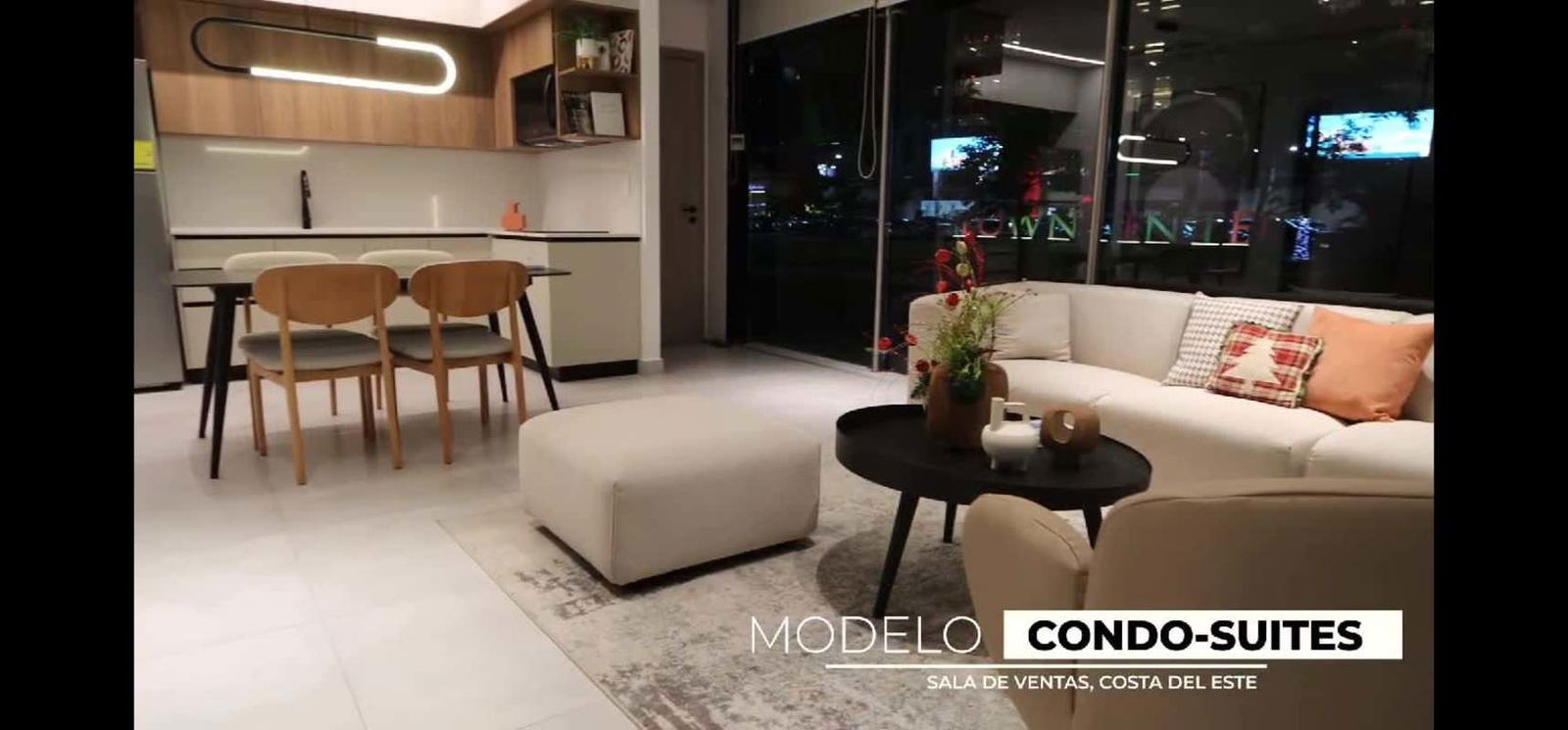 Open plan kitchen with wood cabinetry and living room with city views at Generation Tower Panama