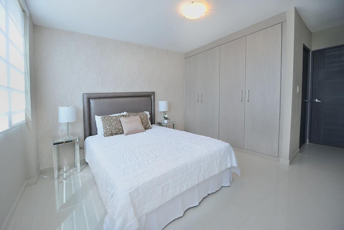 Spacious master bedroom with wardrobe large window Villa de las Fuentes Panama