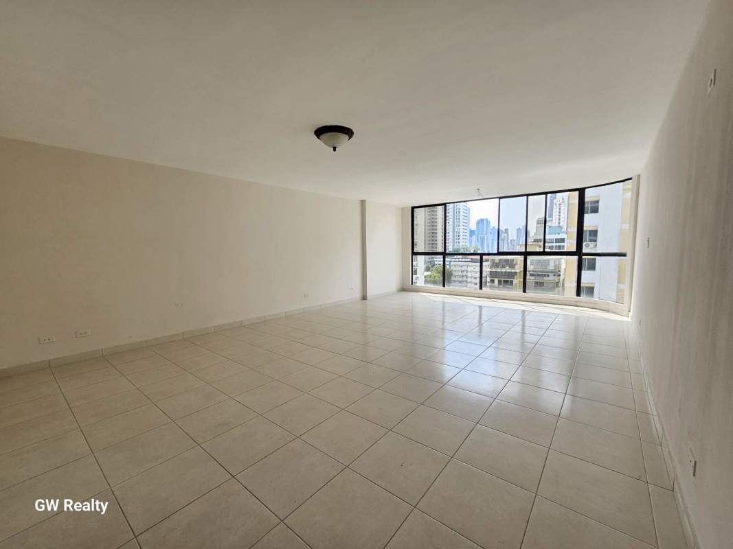 Bright kitchen with granite countertops and white cabinets in PH Terrazas del Cangrejo