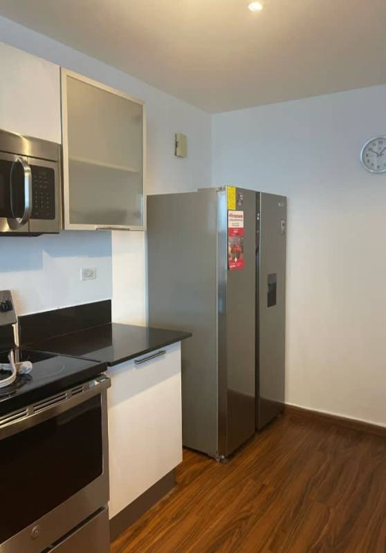 Furnished master bedroom ocean view window at PH Matisse Costa del Este Panama