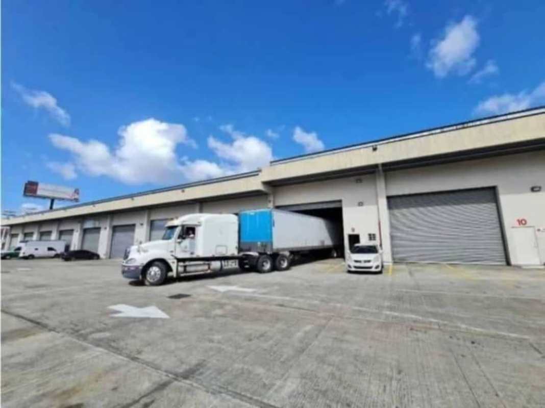 Warehouse exterior roll-up doors parking loading area Don Bosco Panama