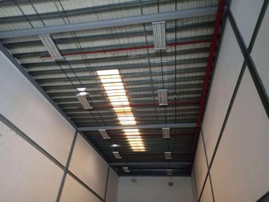 Vaulted ceiling interior warehouse fire sprinklers skylights Don Bosco industrial