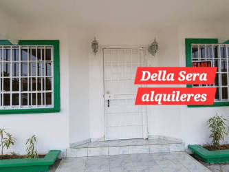 Metal security door, barred windows and small porch Jardines de la Riviera David Panama