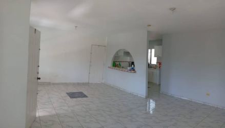 Bright living room with arch to kitchen tile floors rental house David Panama