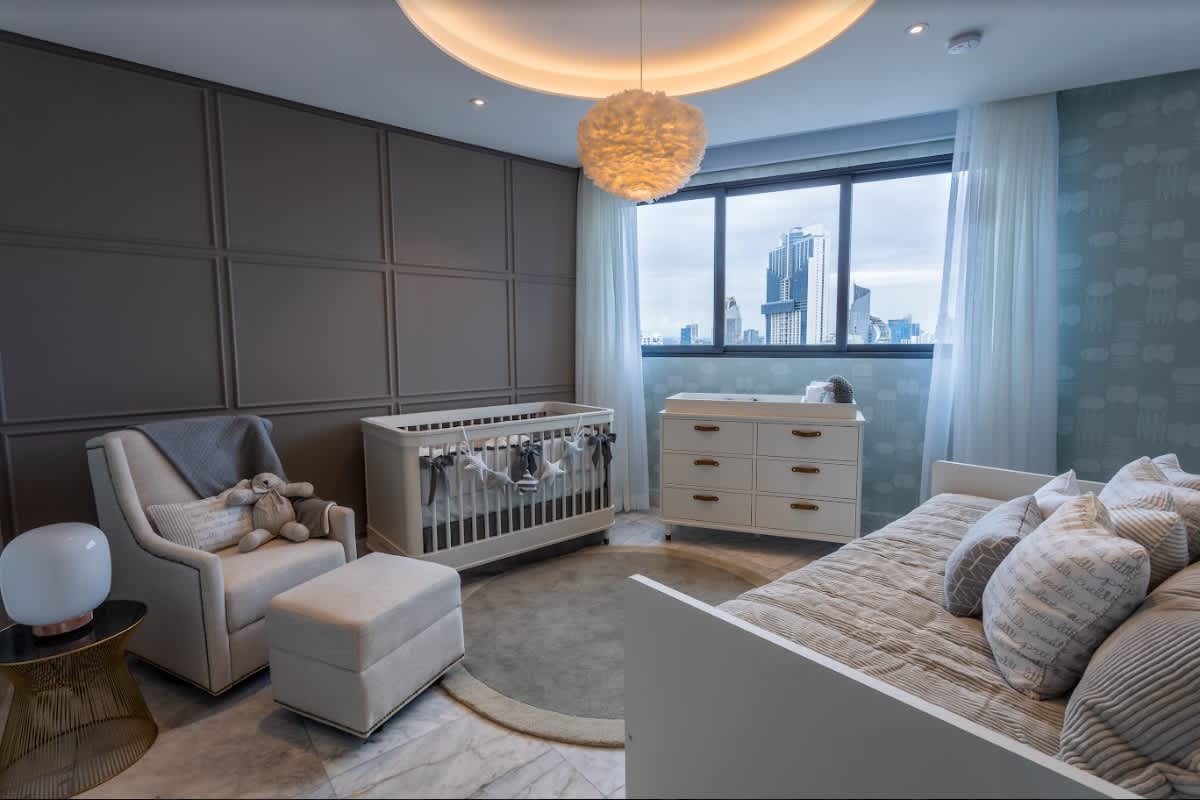 Luxury apartment kitchen in PH Oceanic Tower with modern cabinets and large windows