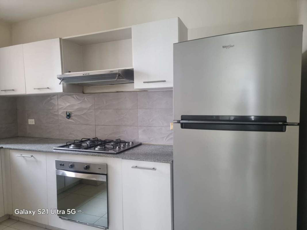 Laundry area with water heater and hookups in PH Torres de Versalles