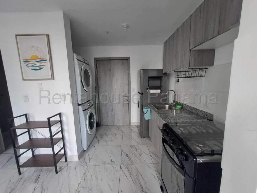 Open kitchen with granite countertops, stainless appliances PH The Gray Calle 50 Panama
