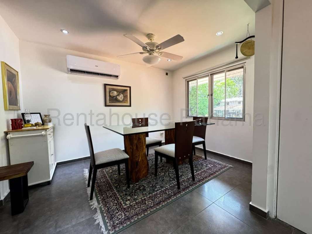 Bedroom with large window and built-in closet facing greenery in Reserve at Clayton Panama