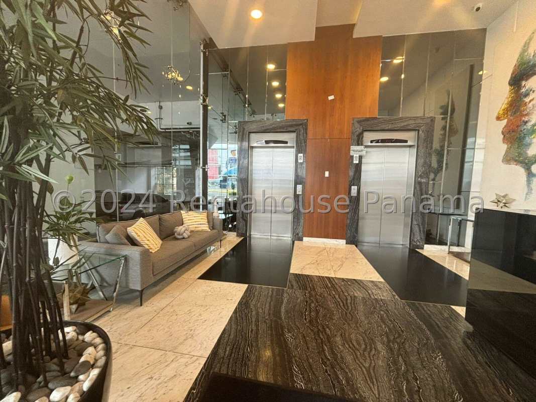 Spacious open plan living and dining area with city view in Metropolitan Park Panama apartment