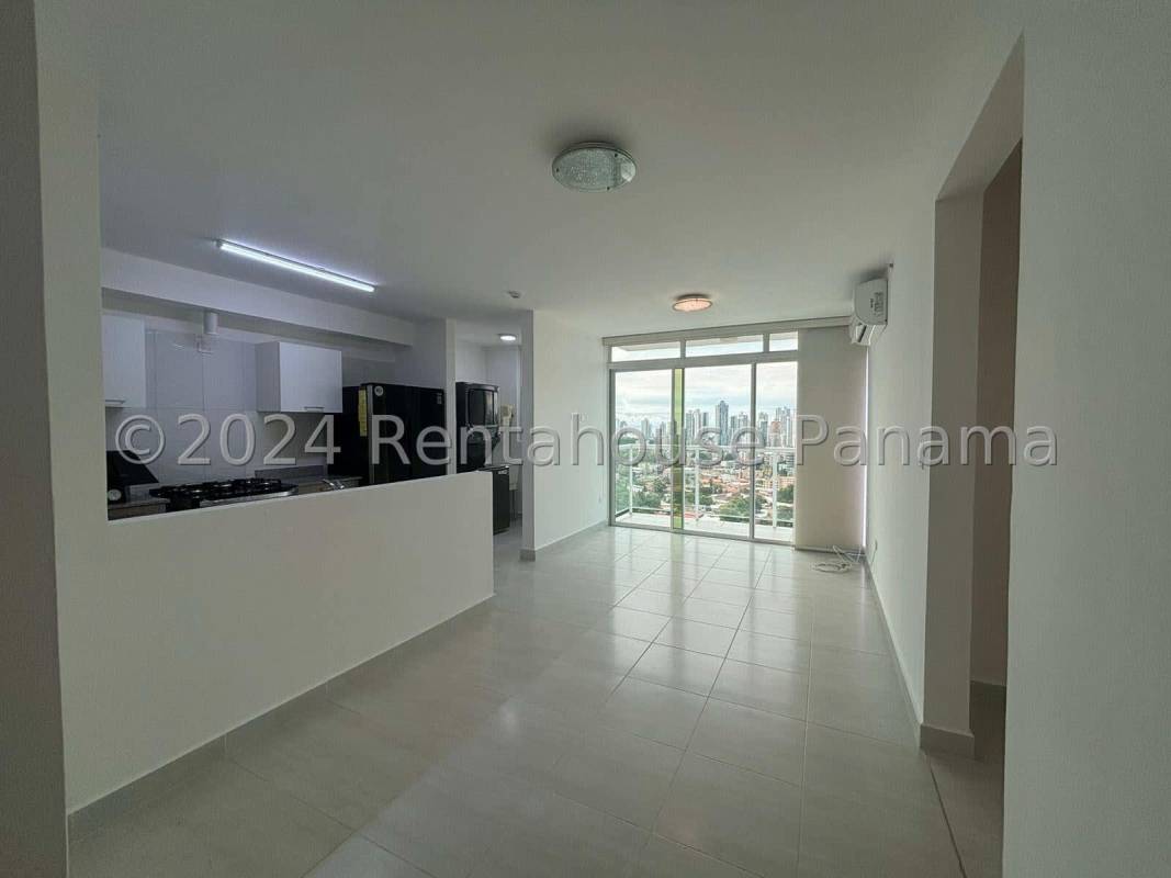 Kitchen with granite counters, appliances, large window and city view in Metropolitan Park Panama