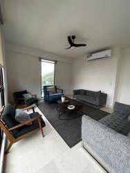 Grand ocean-view living room with floor-to-ceiling windows in penthouse PH Mareas Beach Club Coronado