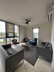 Modern open kitchen with imported finishes and appliances at PH Mareas Beach Club penthouse