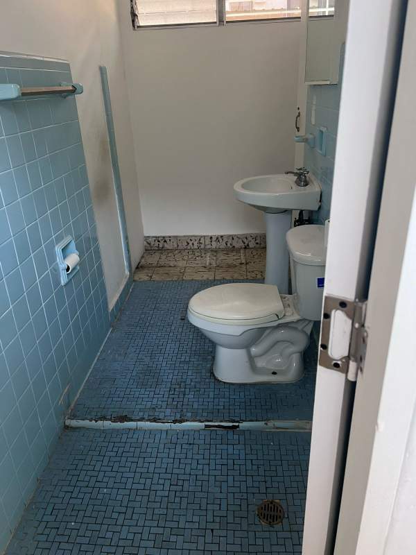 Multiple tiled restrooms with vintage blue tiles in commercial rental El Cangrejo Panama City