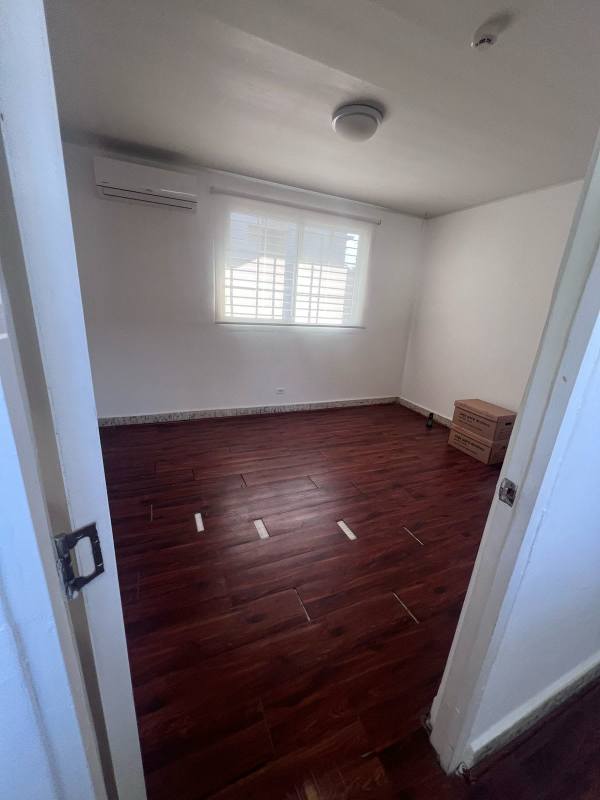 Bright open office area with large windows and wood flooring ideal for admin in Panama City