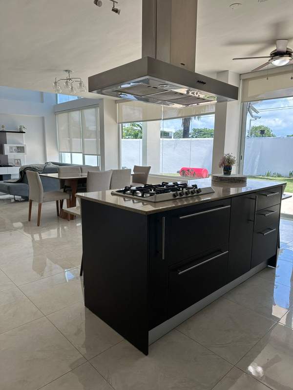 Glass balcony, terrace and lush private garden of spacious house in Costa Esmeralda Panama City