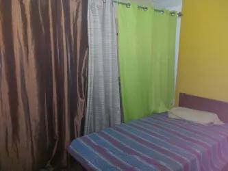 Furnished bedroom with bed colorful accent wall Santiago Panama close to shops