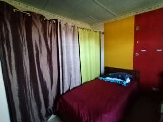 Bedroom with striped curtains accent wall bed Santiago Panama near supermarkets