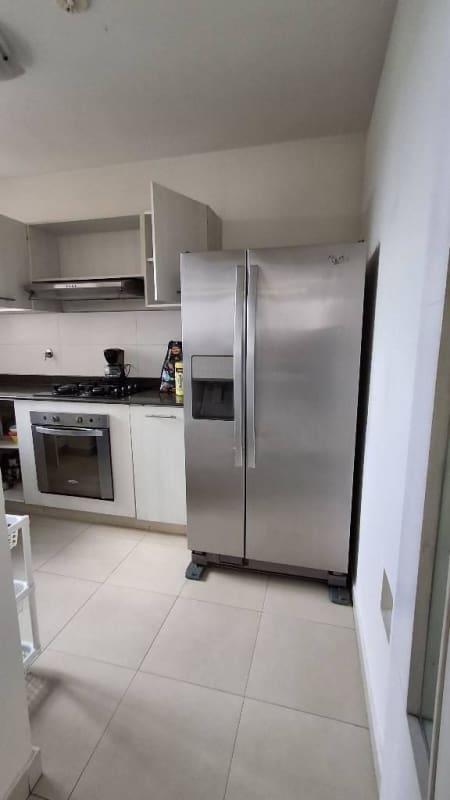 Modern bathroom with glass shower enclosure, vanity and tile flooring Versalles Panama