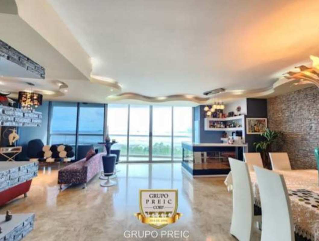 Elegant living and dining area with ocean views in PH Pearl Costa del Este Panama