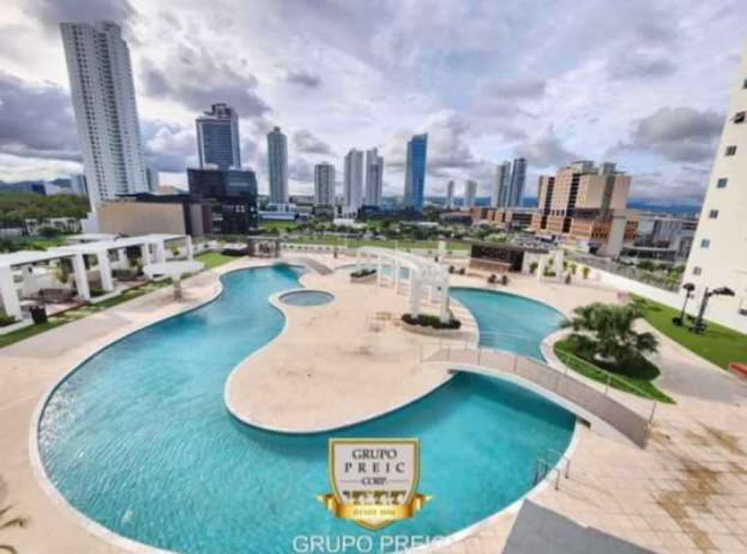 Large outdoor pool with garden and city skyline PH Pearl Costa del Este Panama